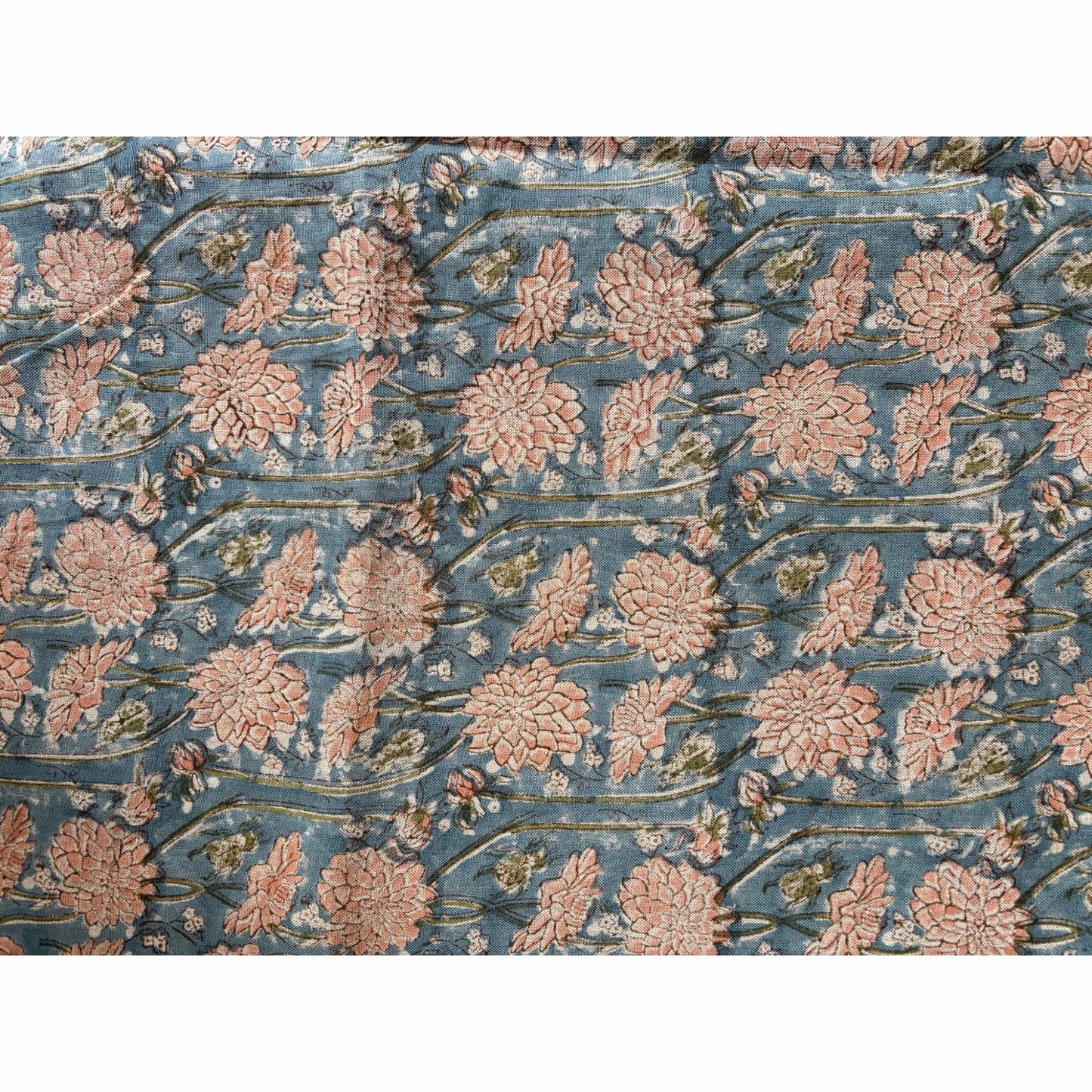 Floral block printed linen tablecloth with pink flowers on a blue background