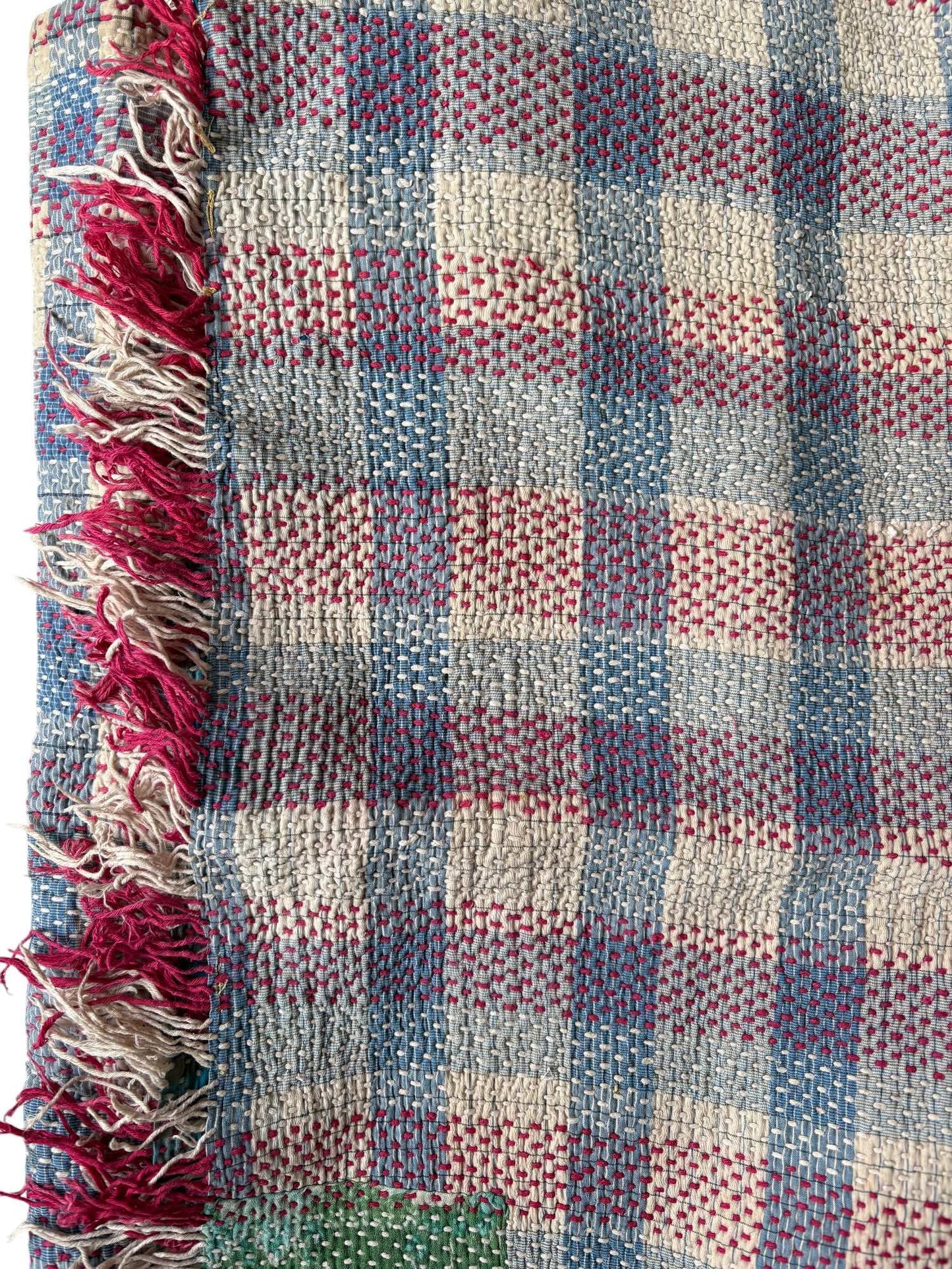 close up blue check kantha rug