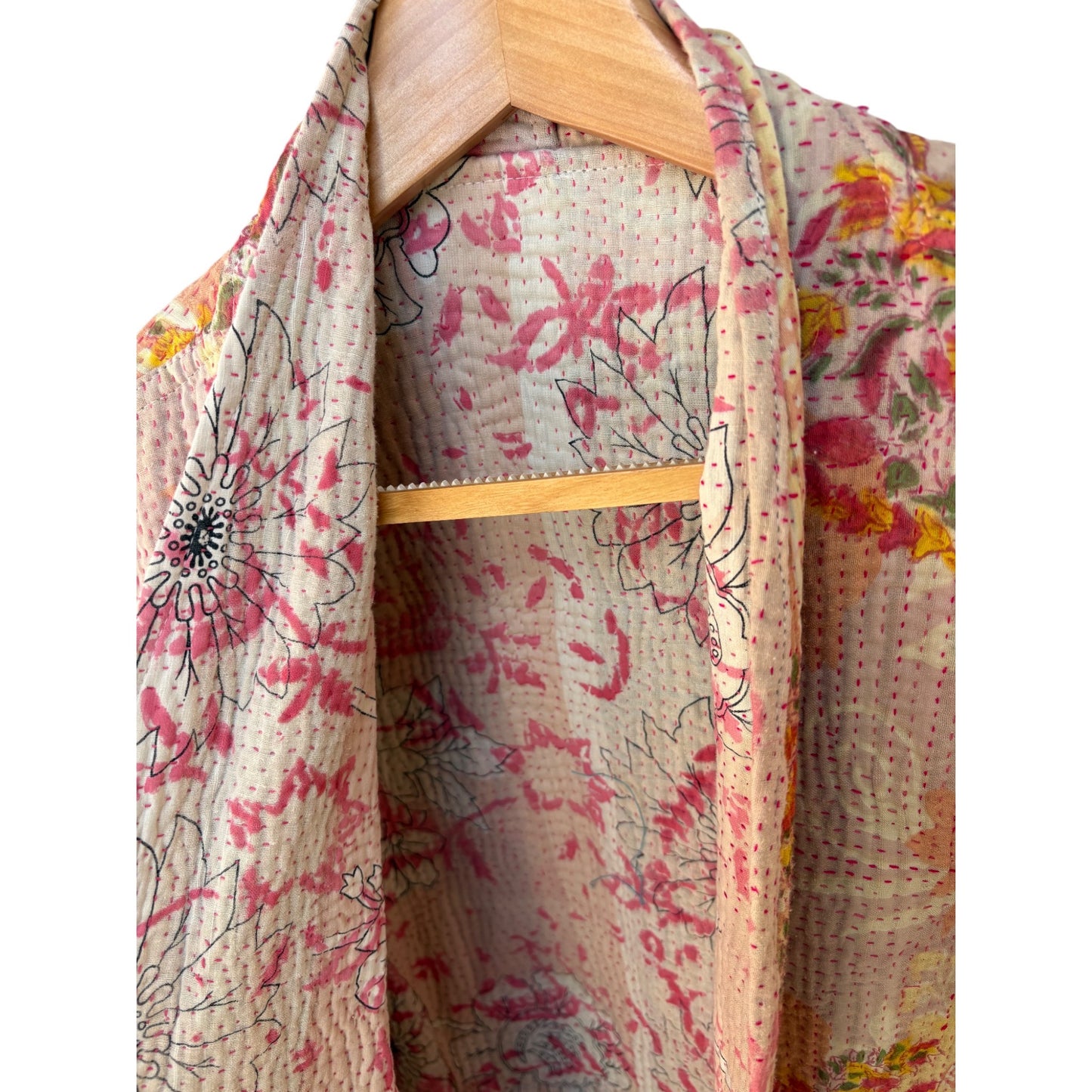 Coral and pink kantha coat close up