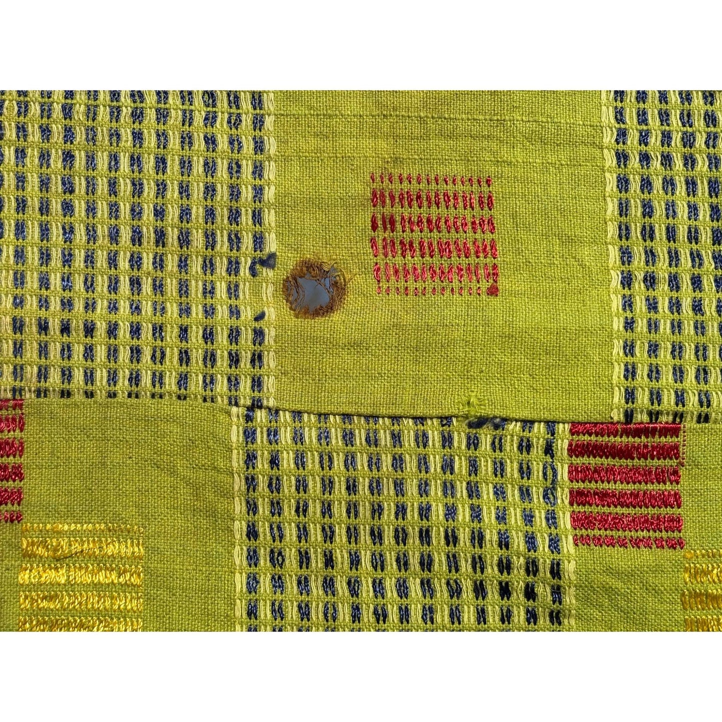 Green kente cloth hole