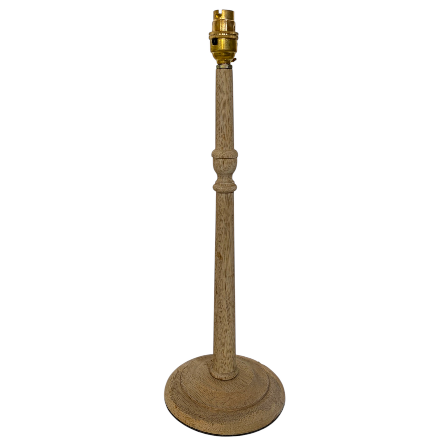 A candlestick mango wood table lamp with a tall, turned wood stem and a round base, featuring a brass-colored socket at the top, shown against a plain white background.