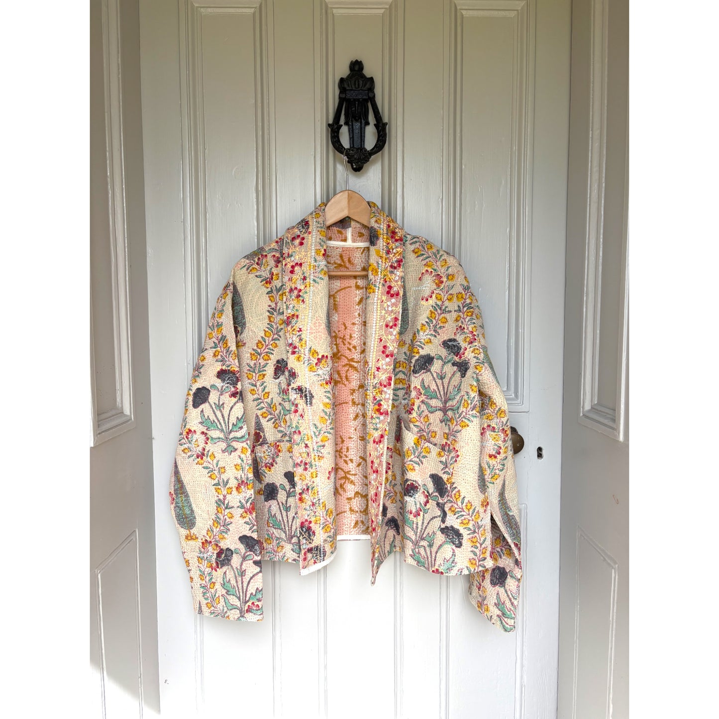 Kantha coat on door