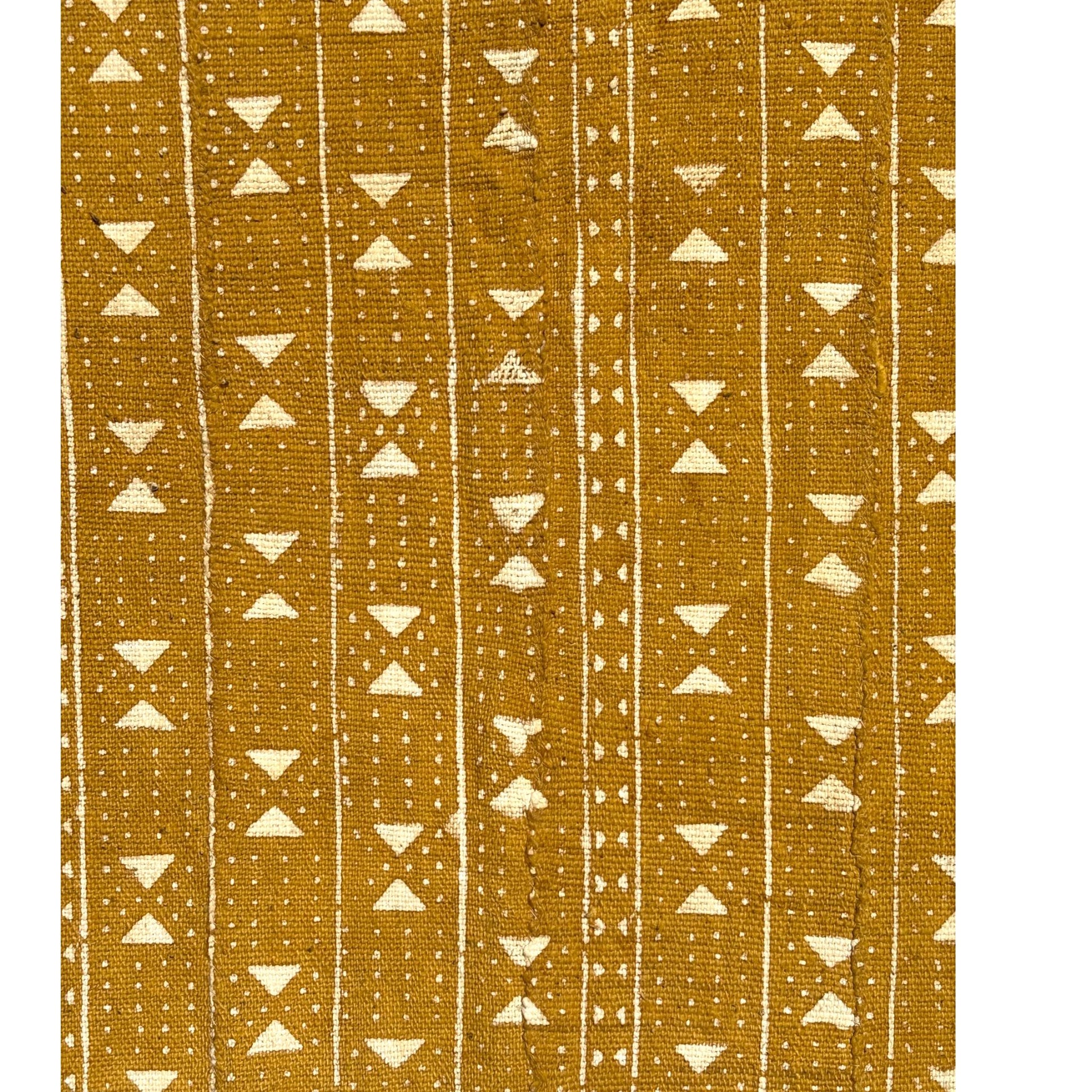 close up mustard mud cloth