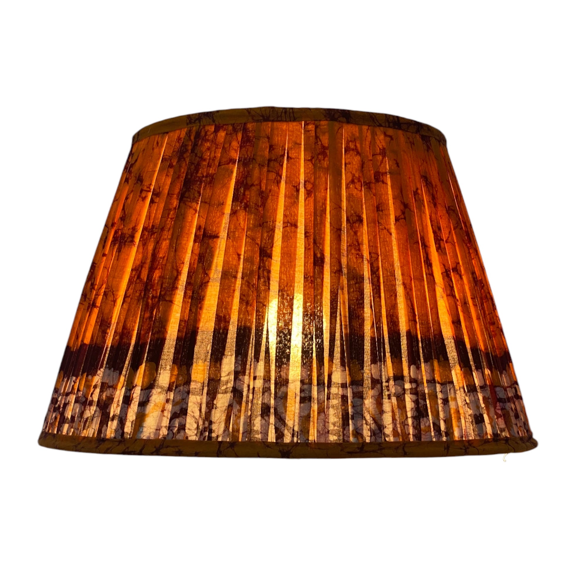 Orange batik lampshade lit