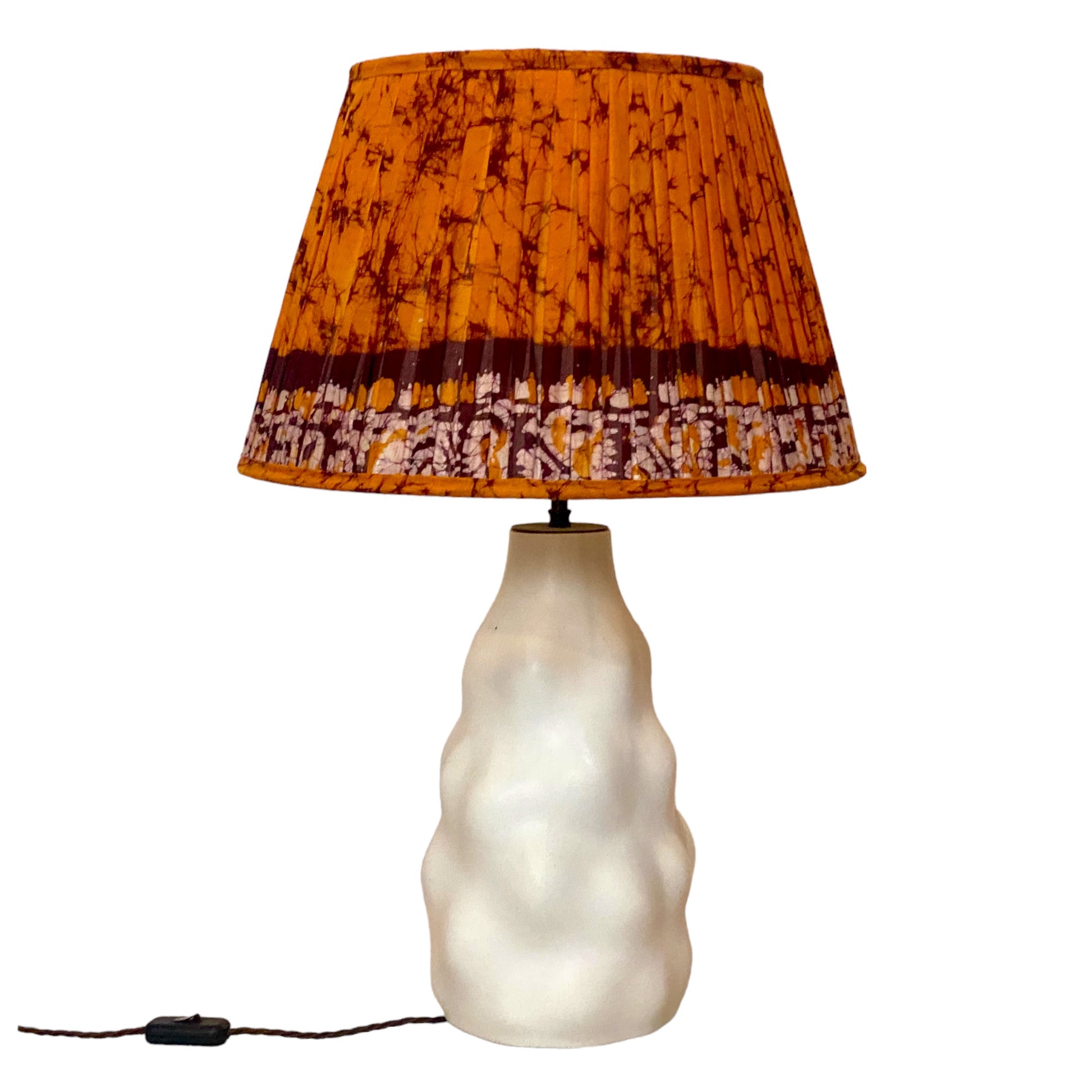 Orange batik lampshade on iki lamp