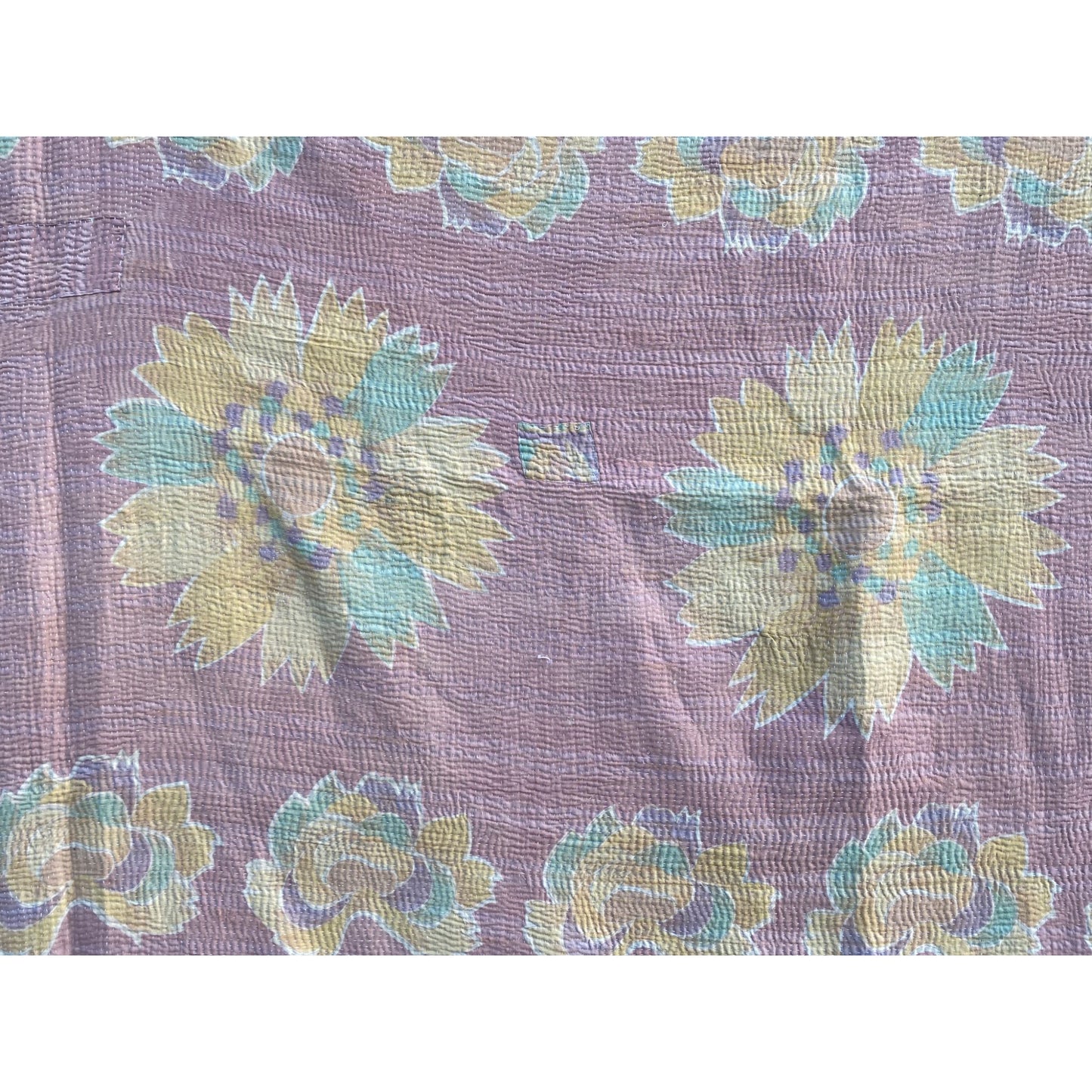Pale aubergine and pink kantha quilt close up