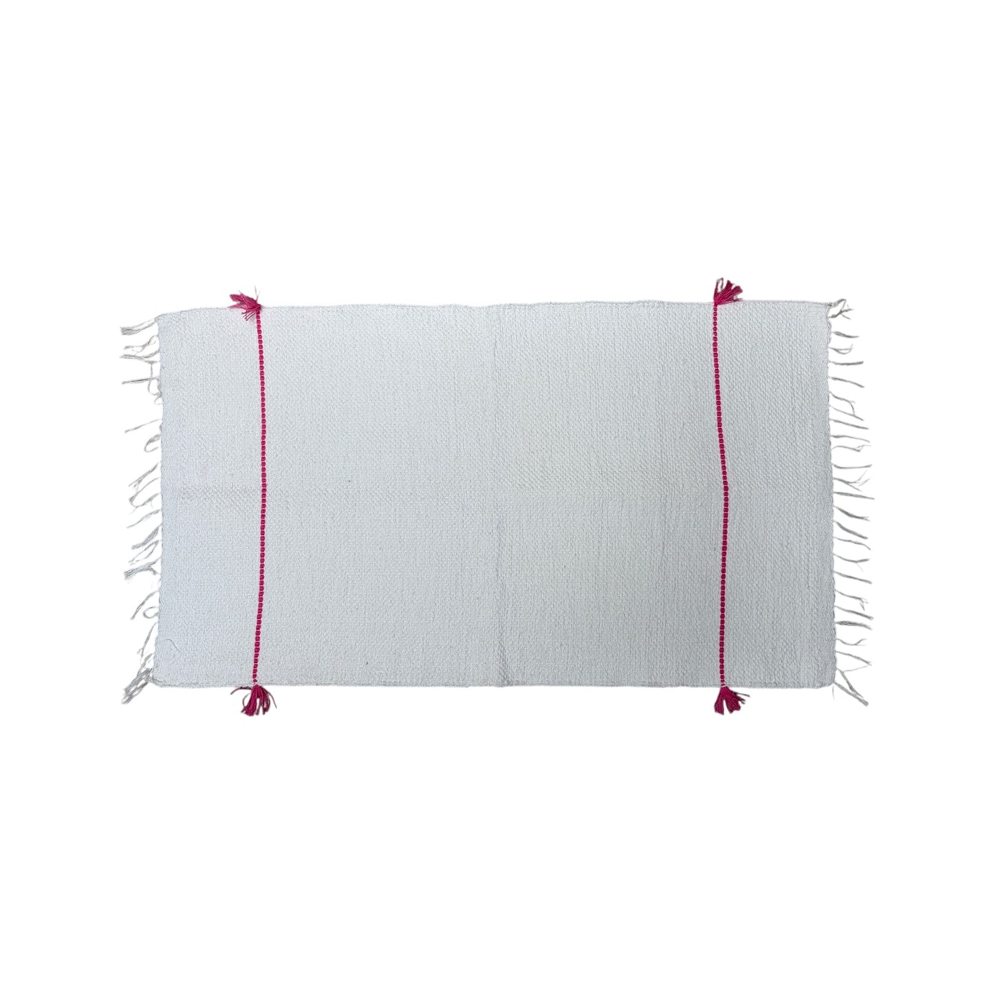 a white bath mat with red stitching on a white background.
