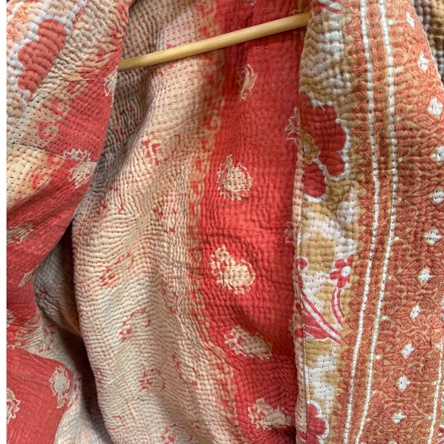Red and orange short kantha coat close up