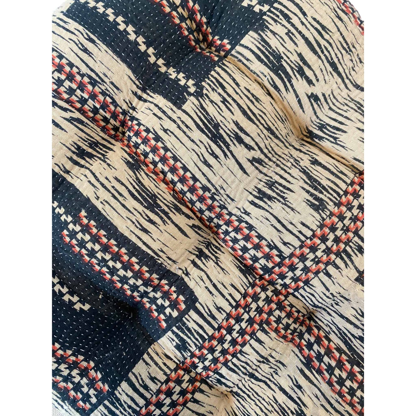 Red white and blue kantha seat cushion close up