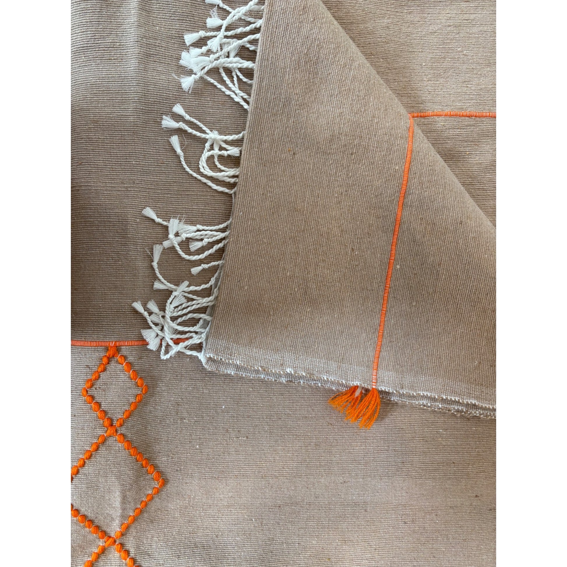 sand with orange bedspread