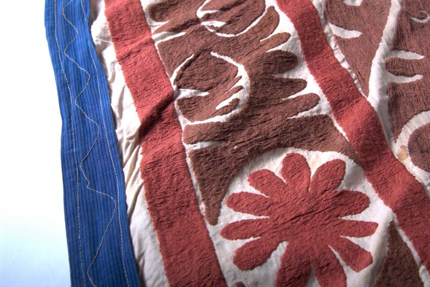 Brown and red suzani close-up of vintage pattern