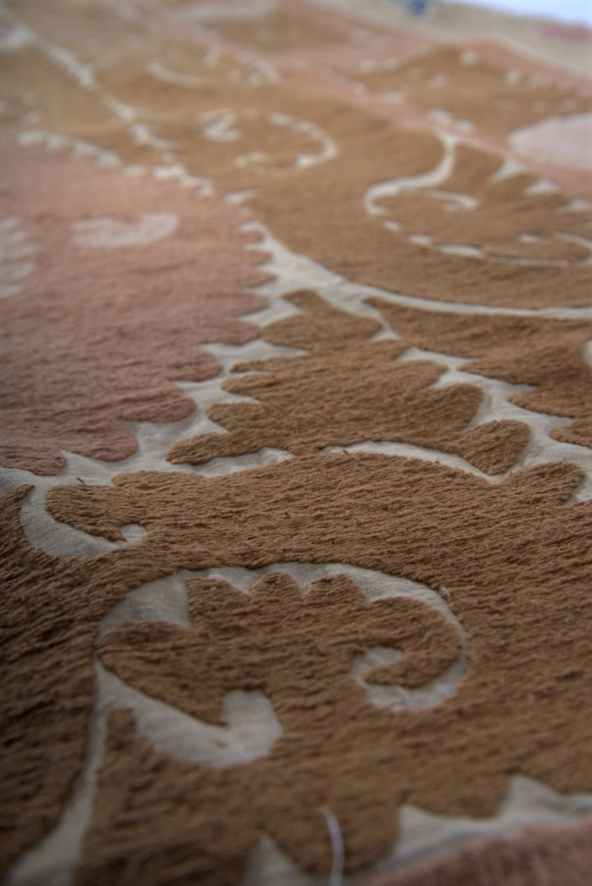 Brown and pink suzani extreme close-up