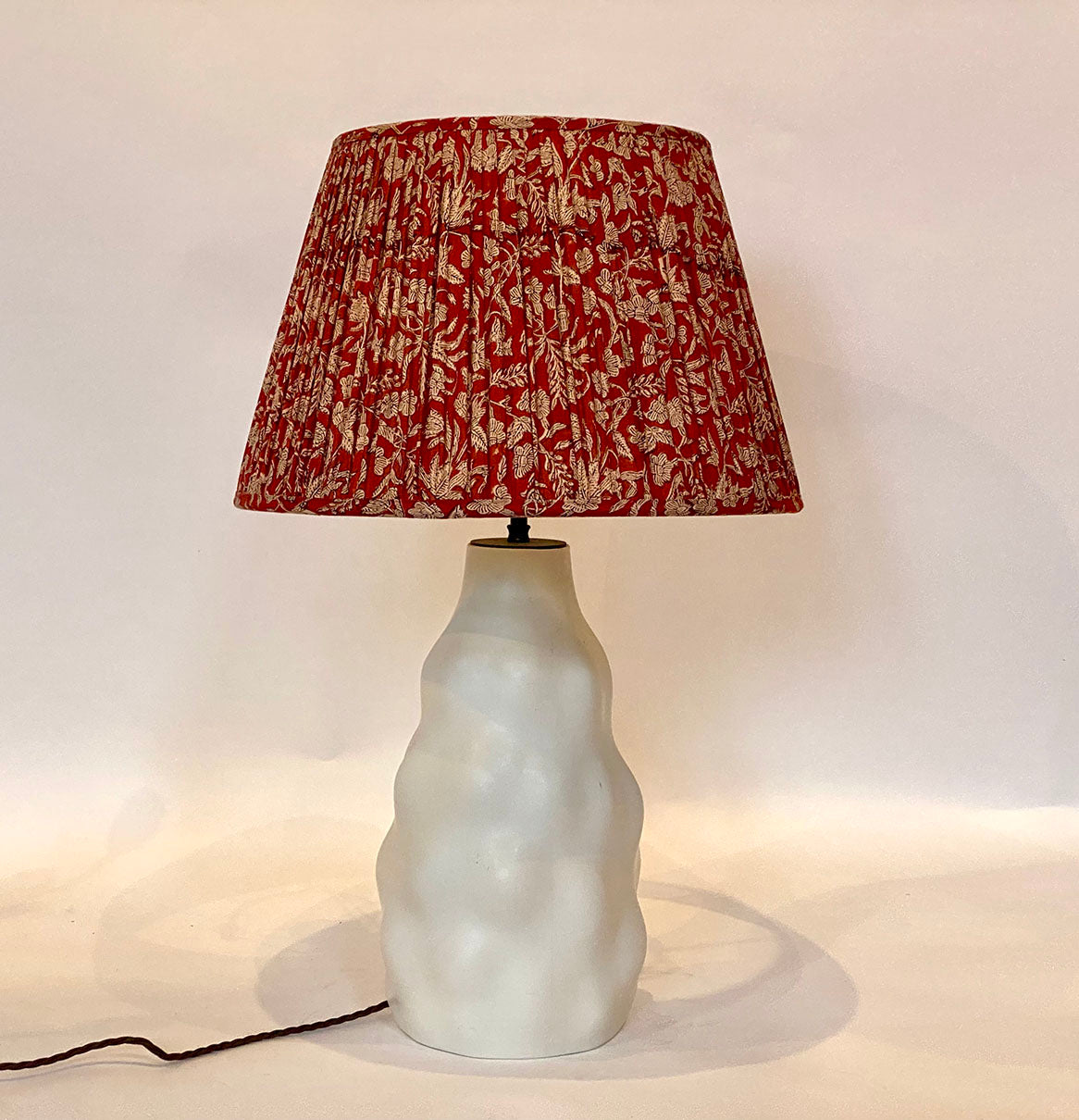 Red Kalamkari Cotton Lampshade shown on an Iki lamp base