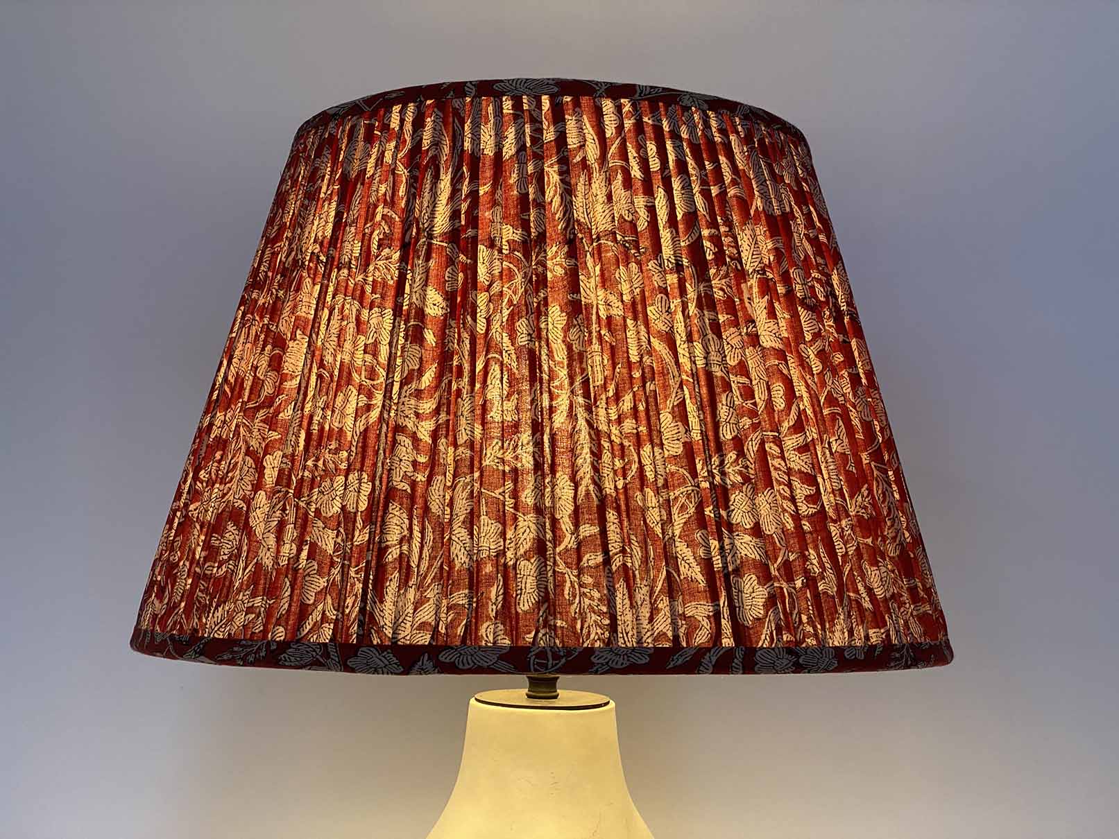 Red Kalamkari Cotton Lampshade shown lit