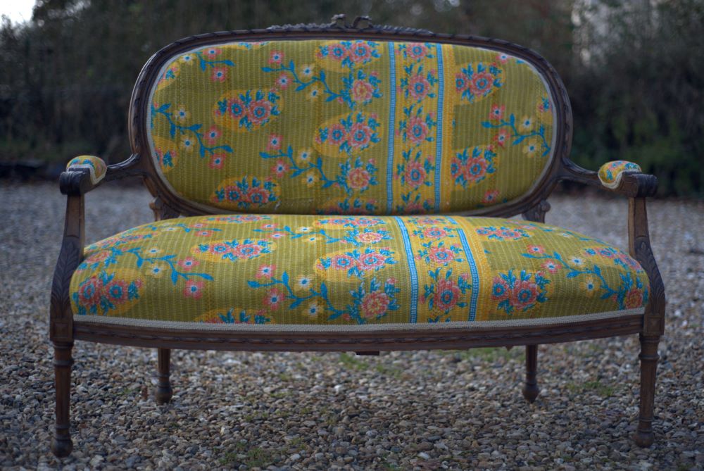 19th century yellow french sofa outdoors