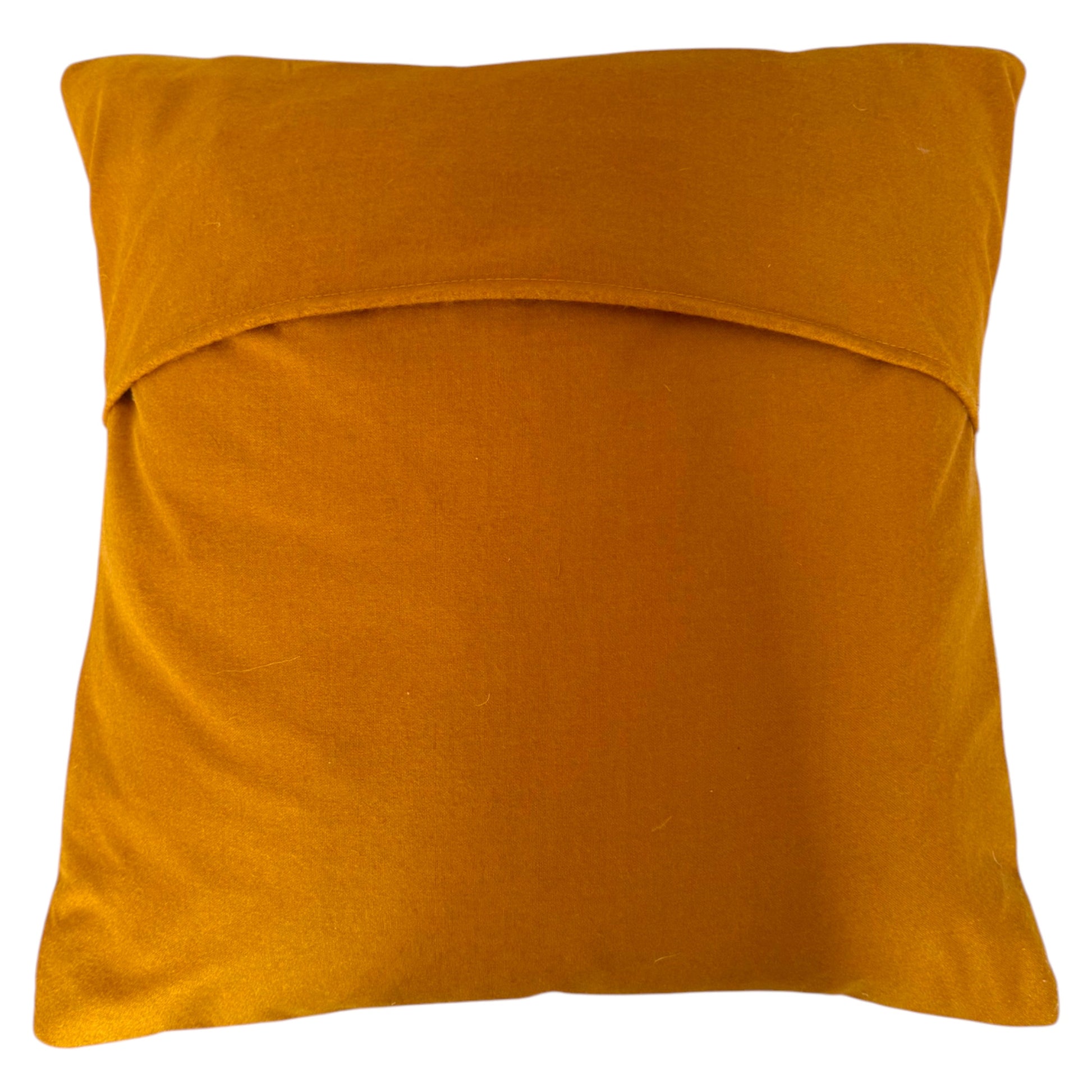 Back view of square Banjara cushion, showing natural turmeric fabric, with a folded top edge, shown against a plain white background.