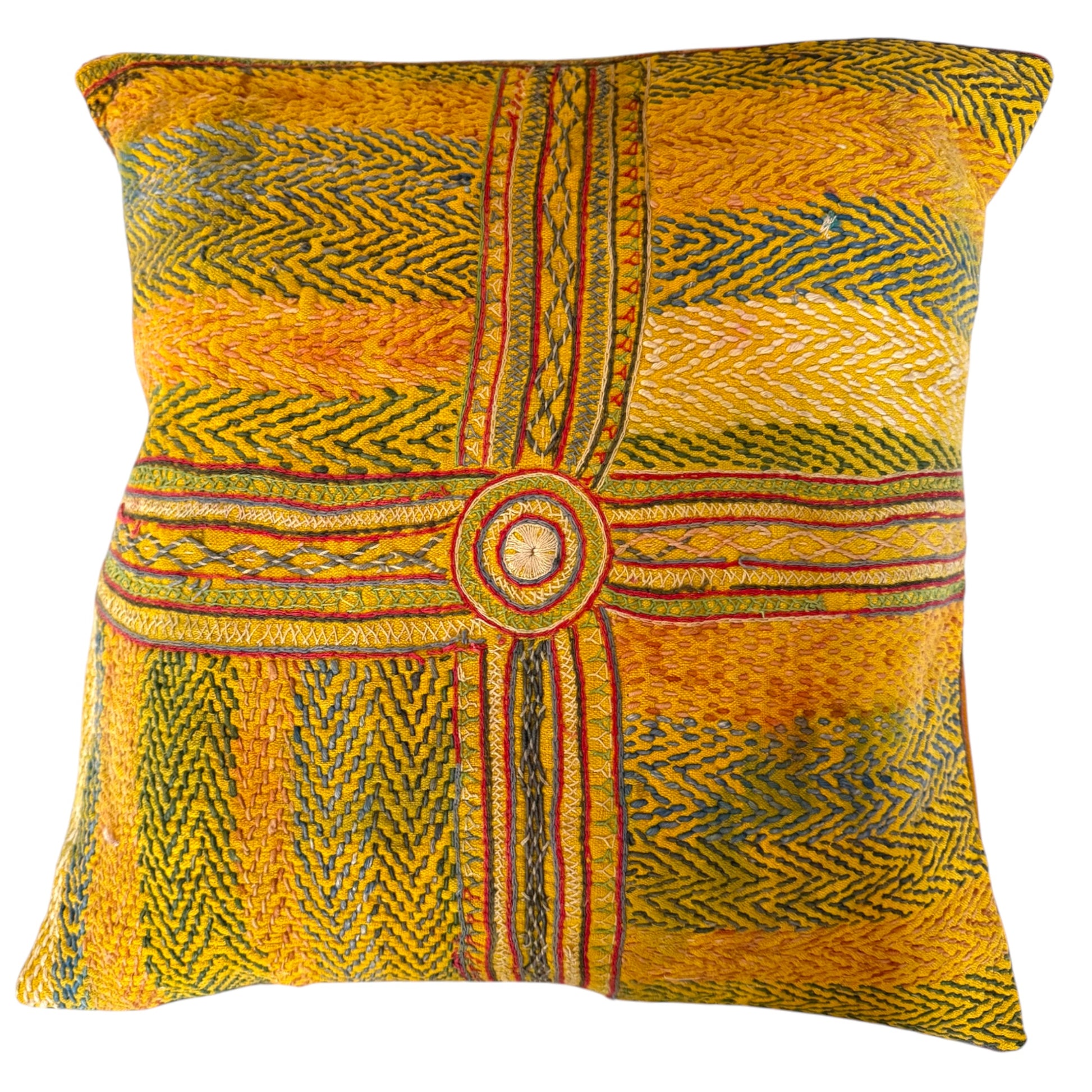 Front view of Banjara yellow embroidered cushion with central circular medallion and cross-stripe geometric pattern in green, red, blue, and cream.