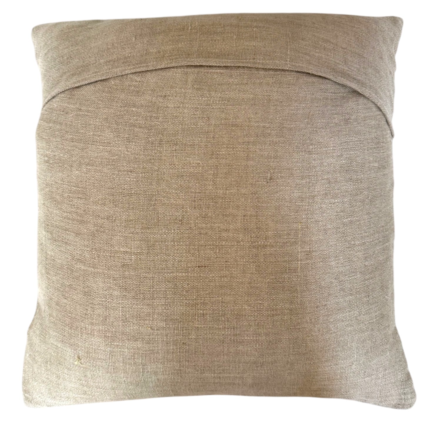 Back view of Banjara Rainbow cushion showing plain natural linen reverse in beige, with envelope closure.