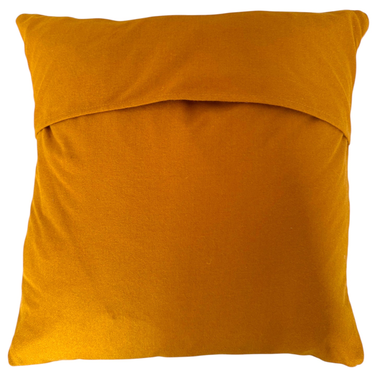 Back view of the square Banjara cushion showing turmeric natural fabric with a folded top edge, shown against a plain white background.