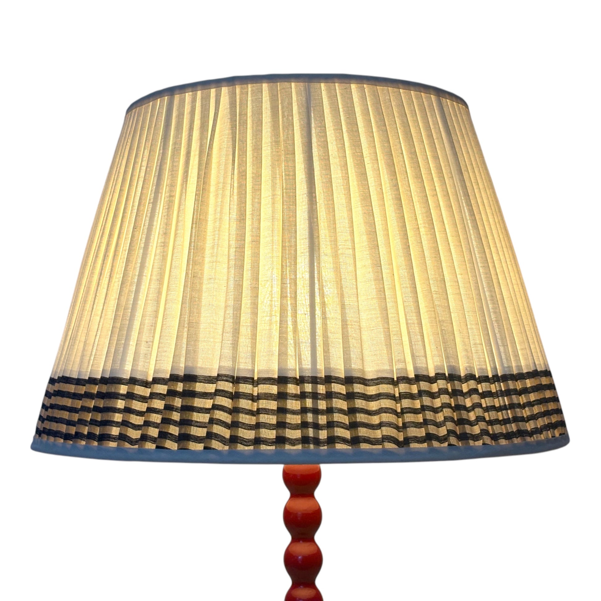 Black and dull gold keralan cotton lampshade lit
