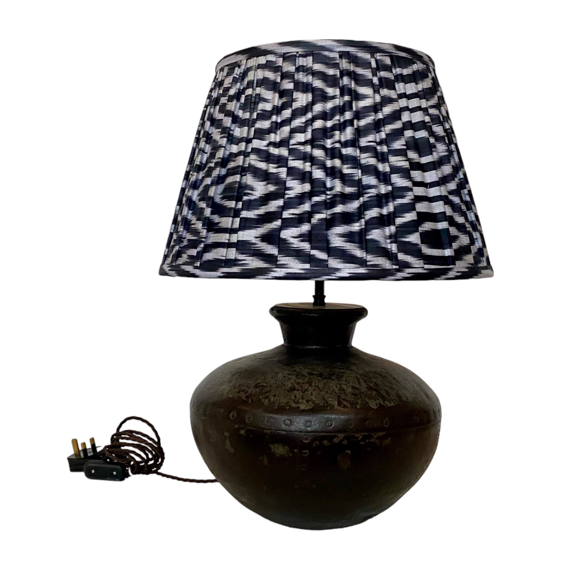 Black and grey ikat lampshade on Water carrier lamp base