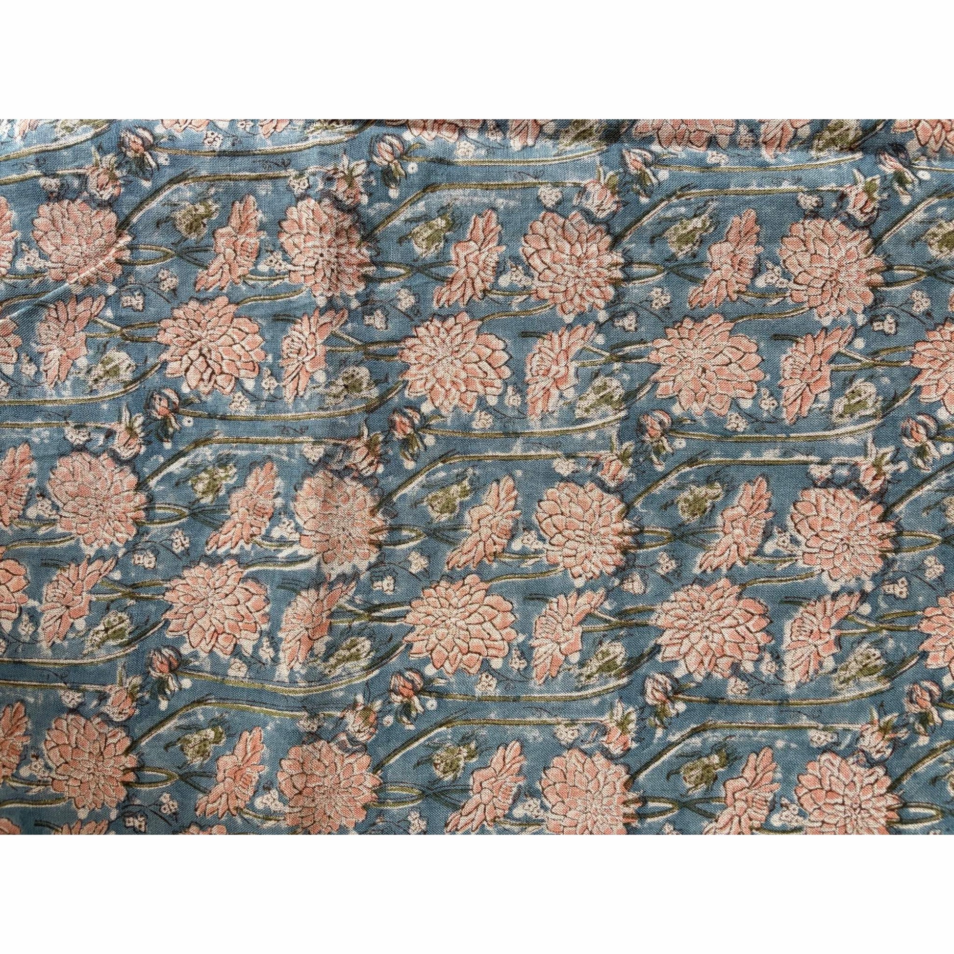 Floral block printed linen tablecloth with pink flowers on a blue background