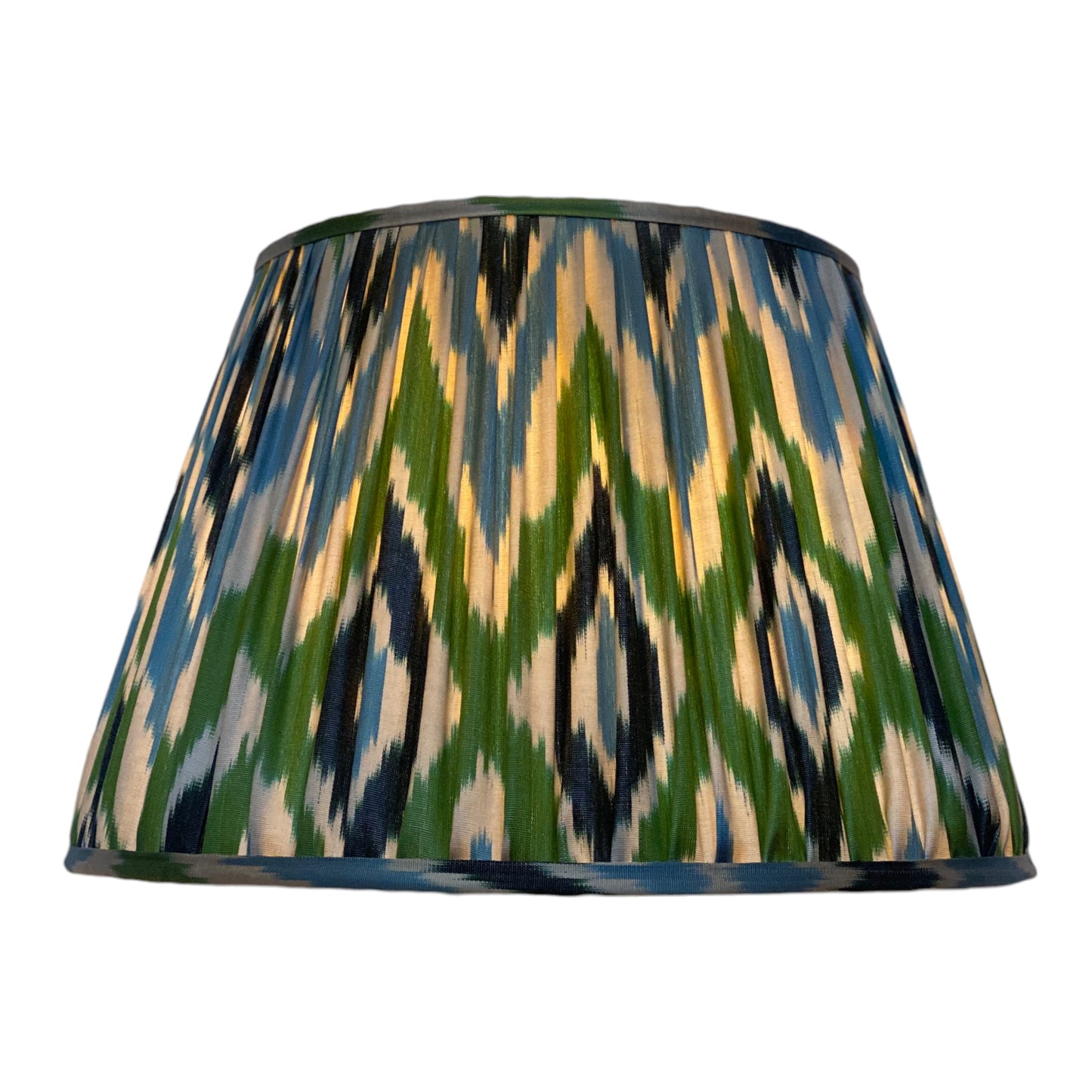 Blue and green ikat silk lampshade lit
