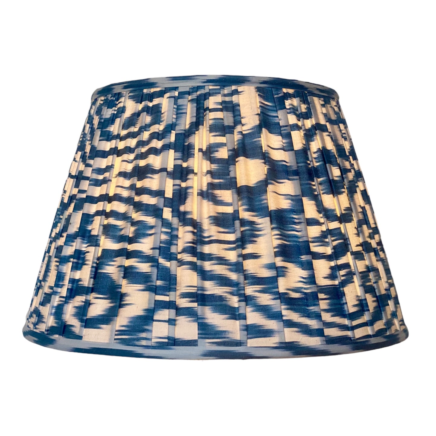Blue and white ikat lampshade lit