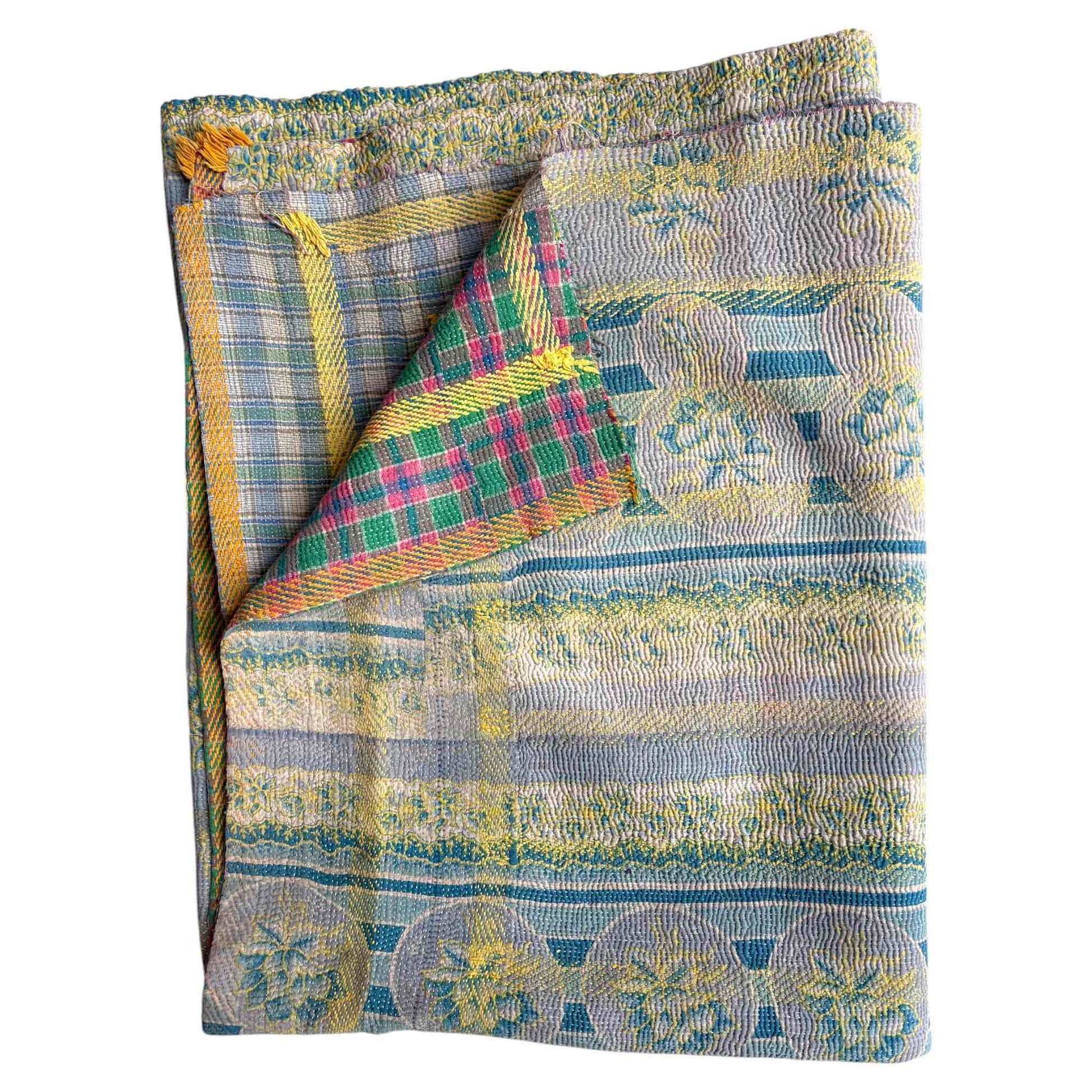 Blue and yellow kantha quilt