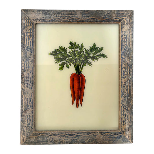 A framed botanical art print featuring three orange carrots with green leafy tops on an off-white background, enclosed in a distressed rustic wooden frame.