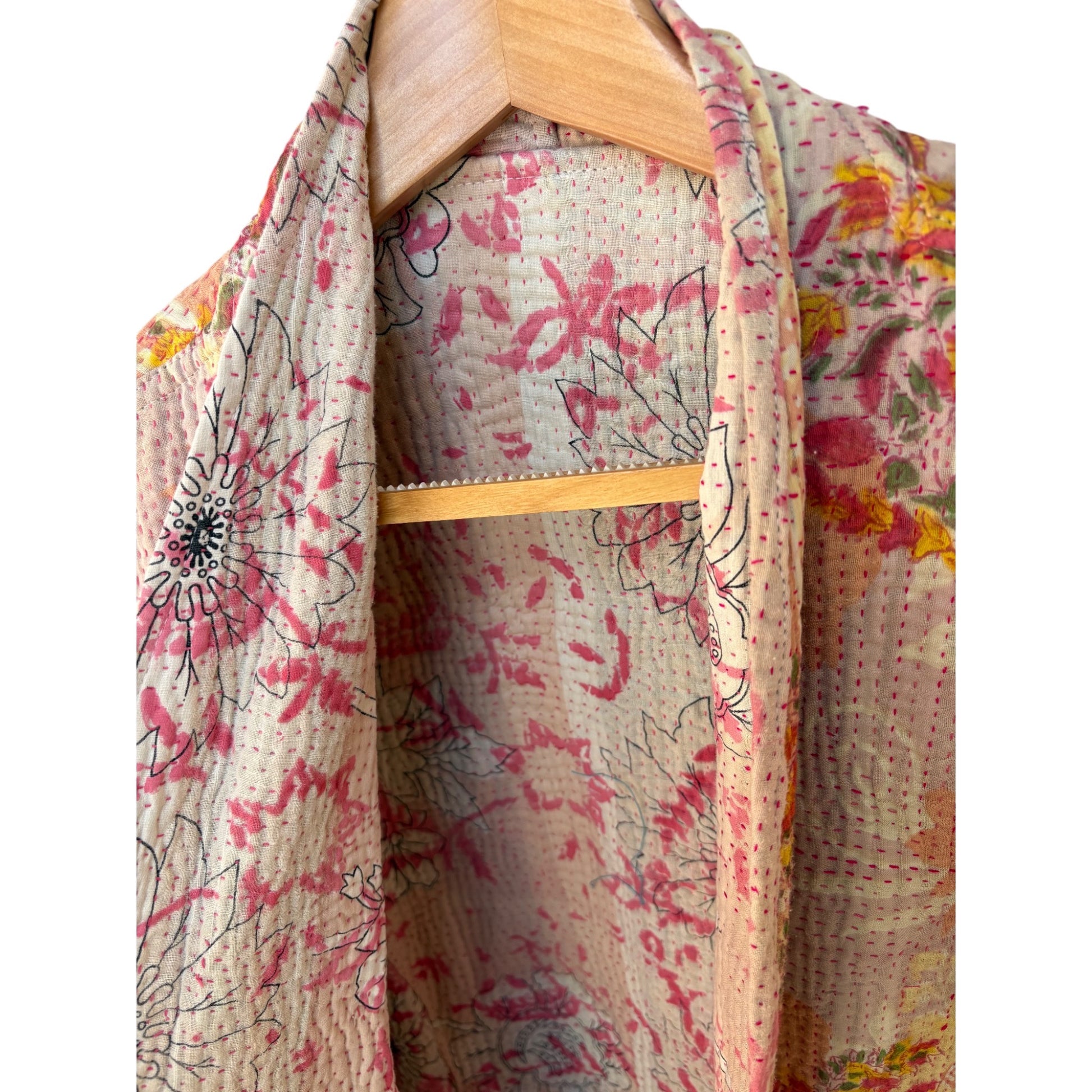 Coral and pink kantha coat close up