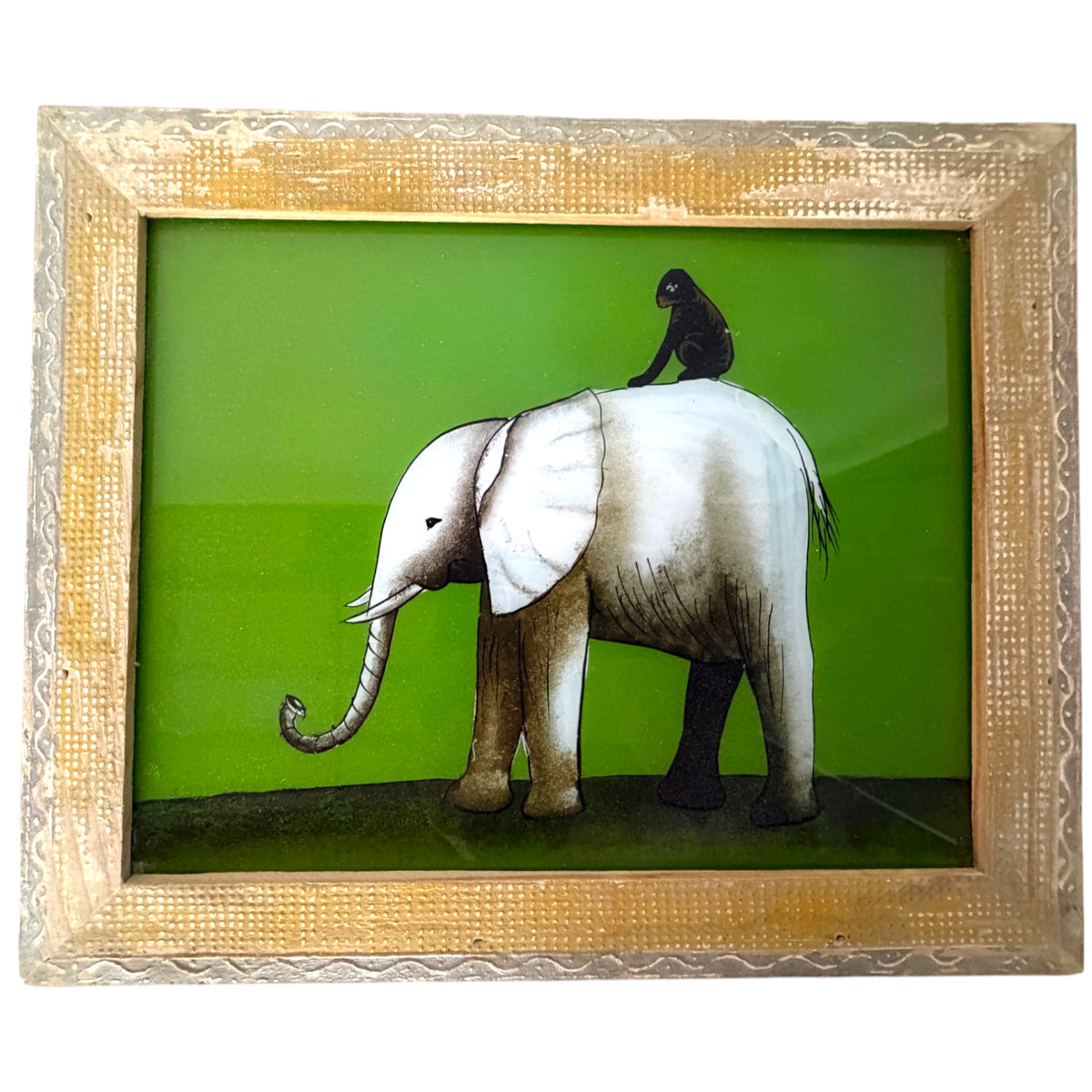 A framed art print featuring a painted elephant in profile with a small black monkey sitting on its back, set against a bright green background and enclosed in an ornate textured gold frame.