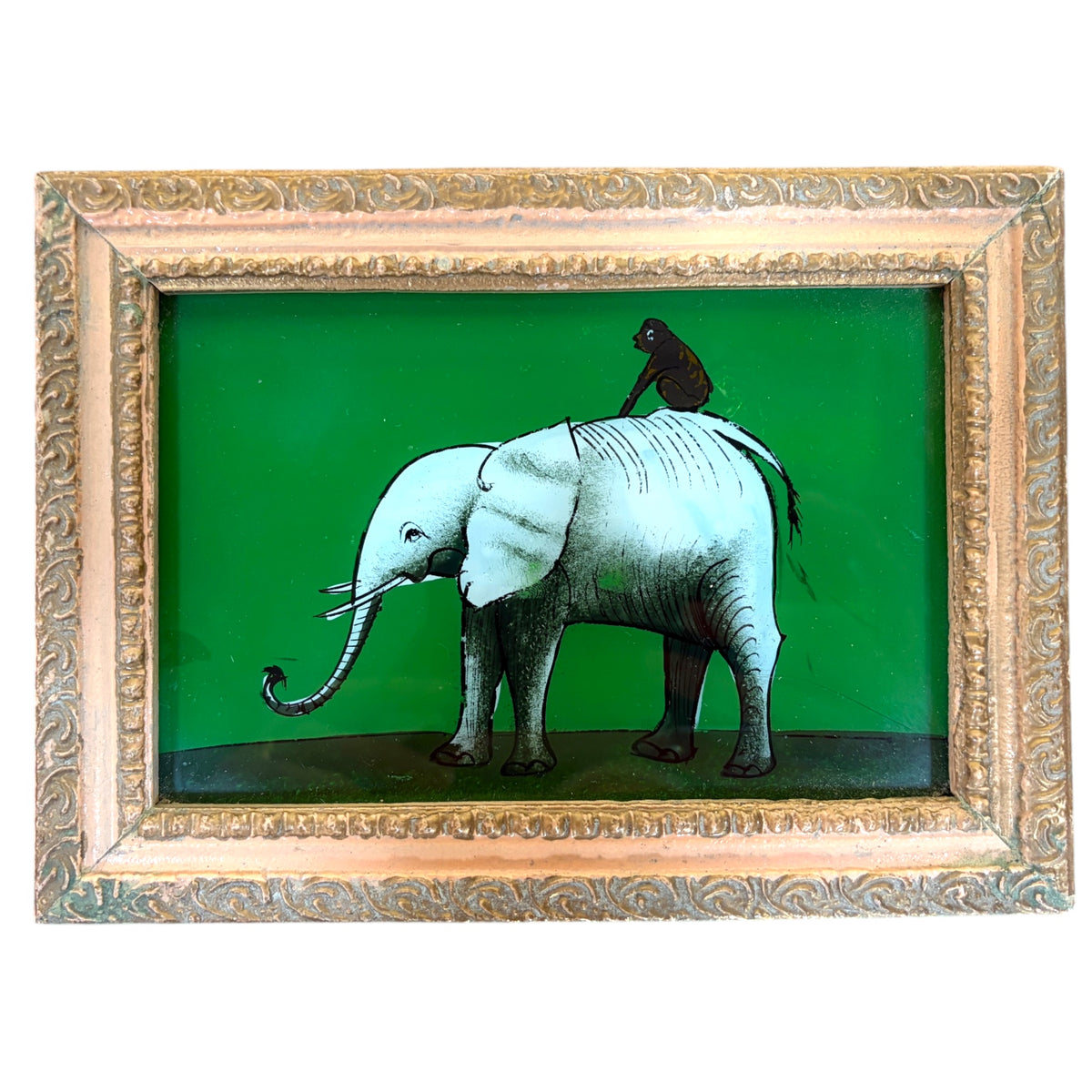 a pale elephant with a small dark monkey perched on its back, set against a deep green ground. Ornate embossed gilt frame.
