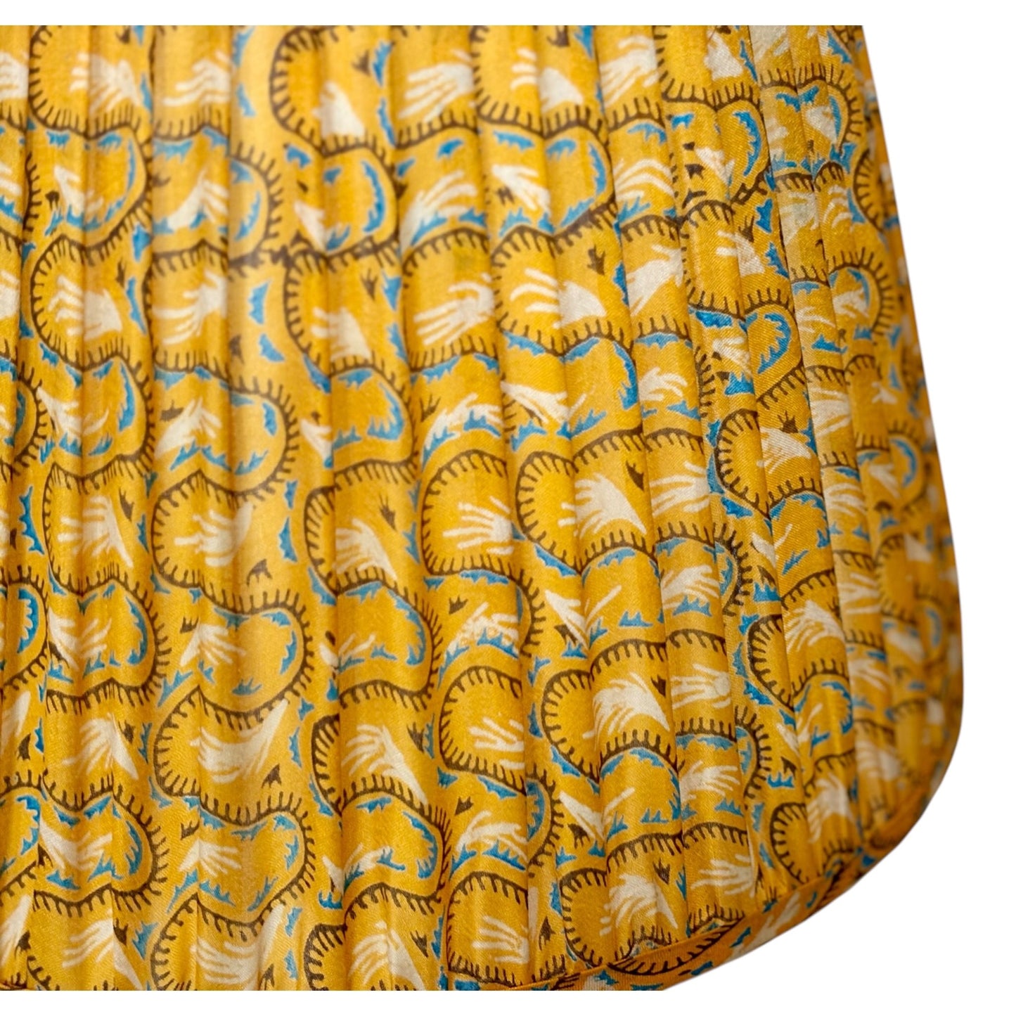 Close up of gold vintage silk sari lampshade 
