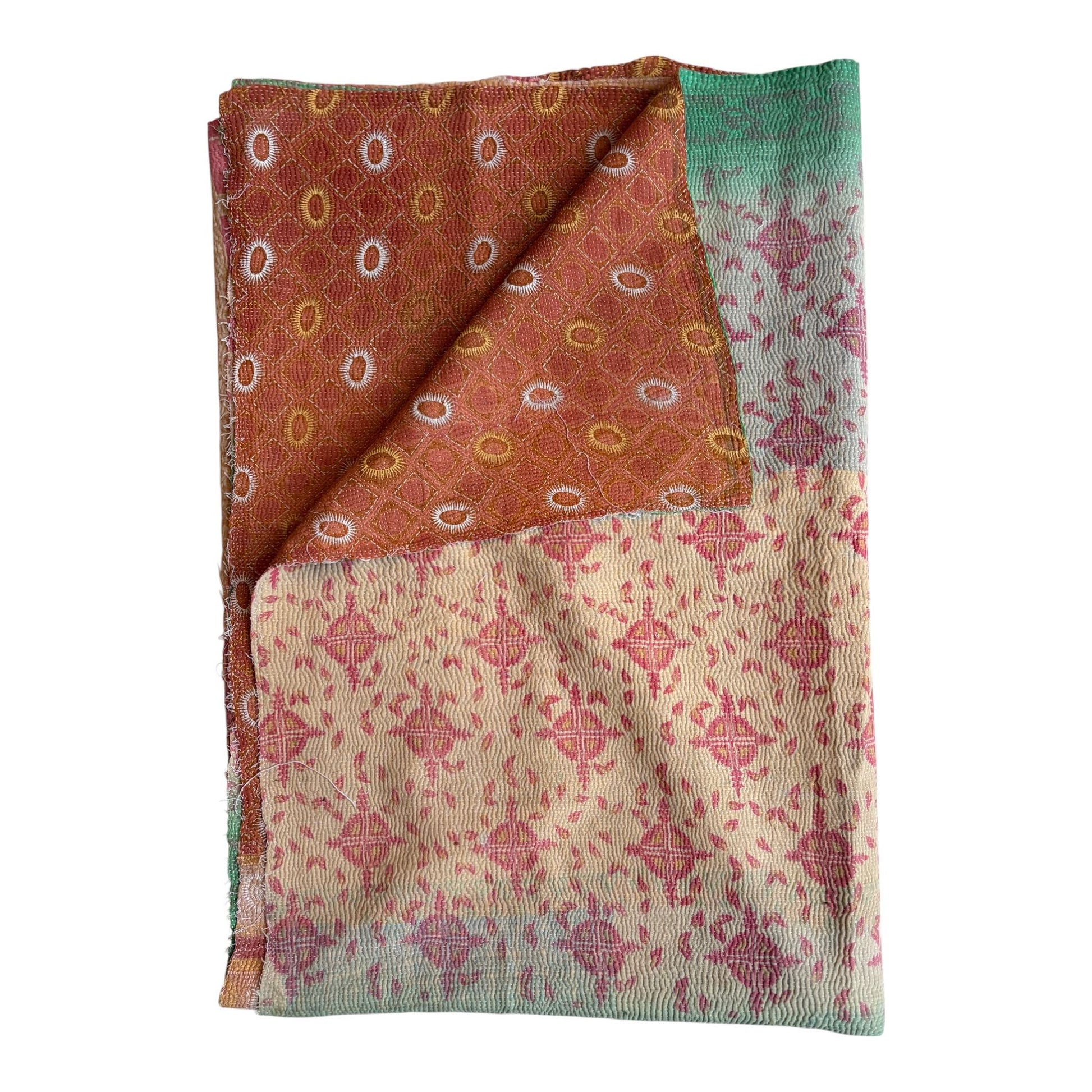 Green and red kantha quilt
