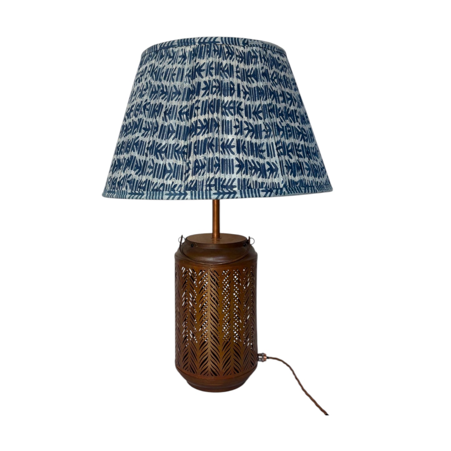 A indigo cactus lampshade shown here with a dark brown woven base. 