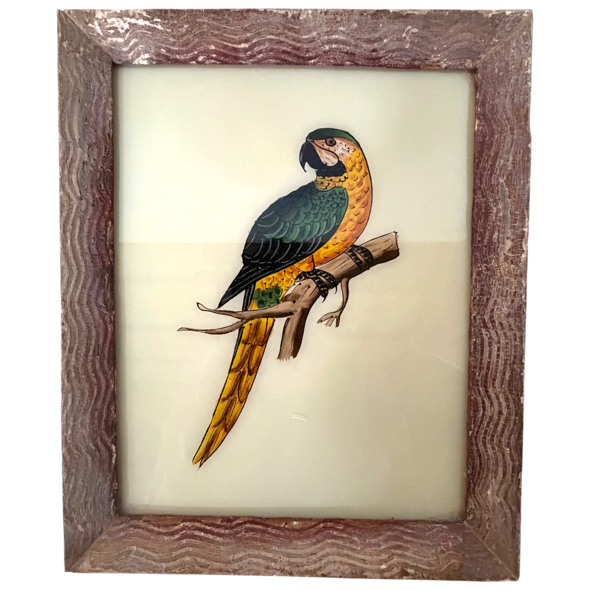 Hand-painted green and yellow macaw perched on a branch, reverse glass painting in a rustic wavy frame