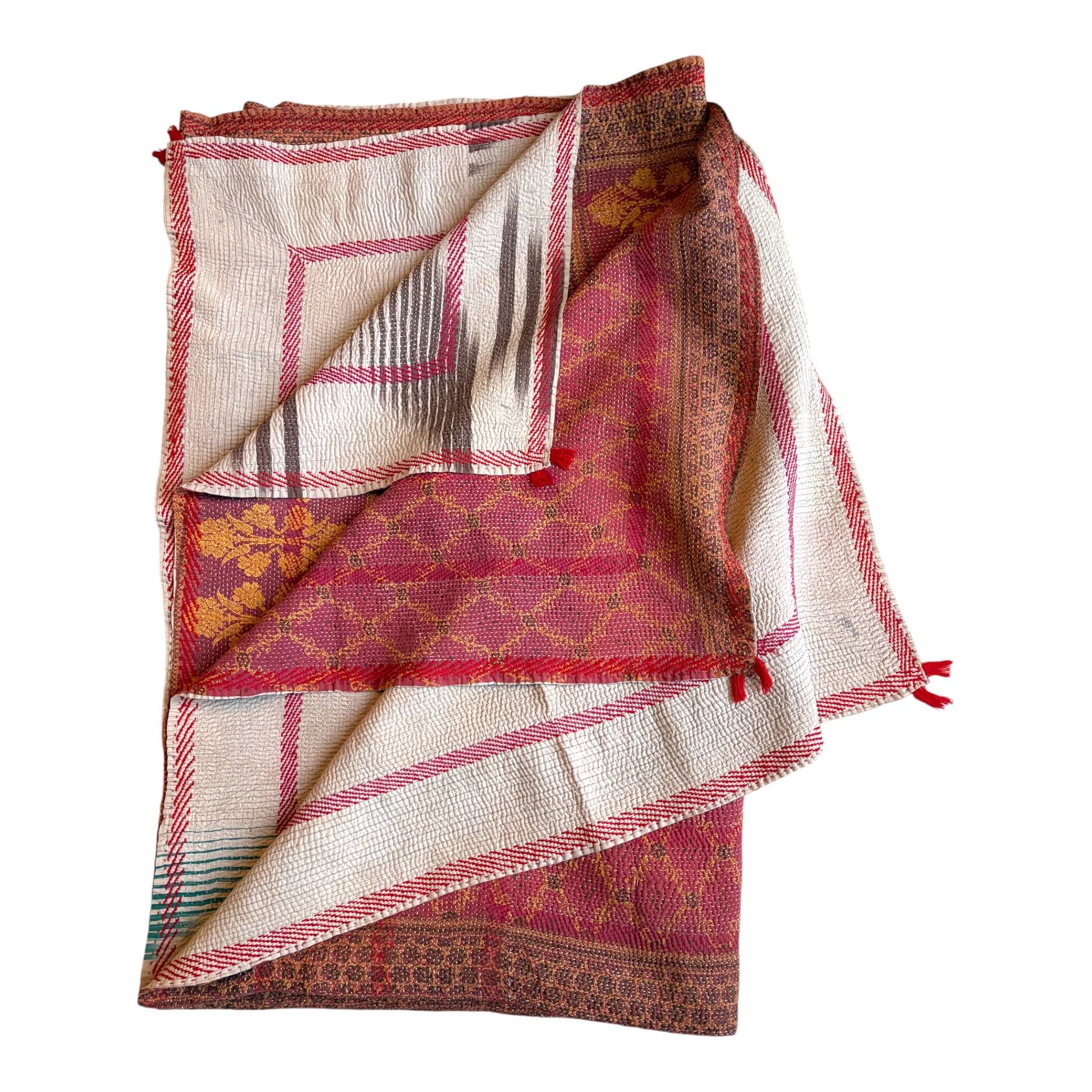 Magenta and yellow kantha quilt folded