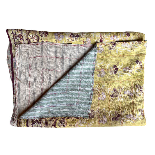 Yellow and magenta kantha quilt