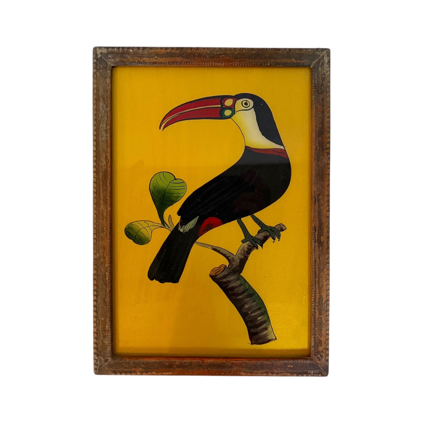 glass paining of a toucan on a gold background in a wooden frame on a white background