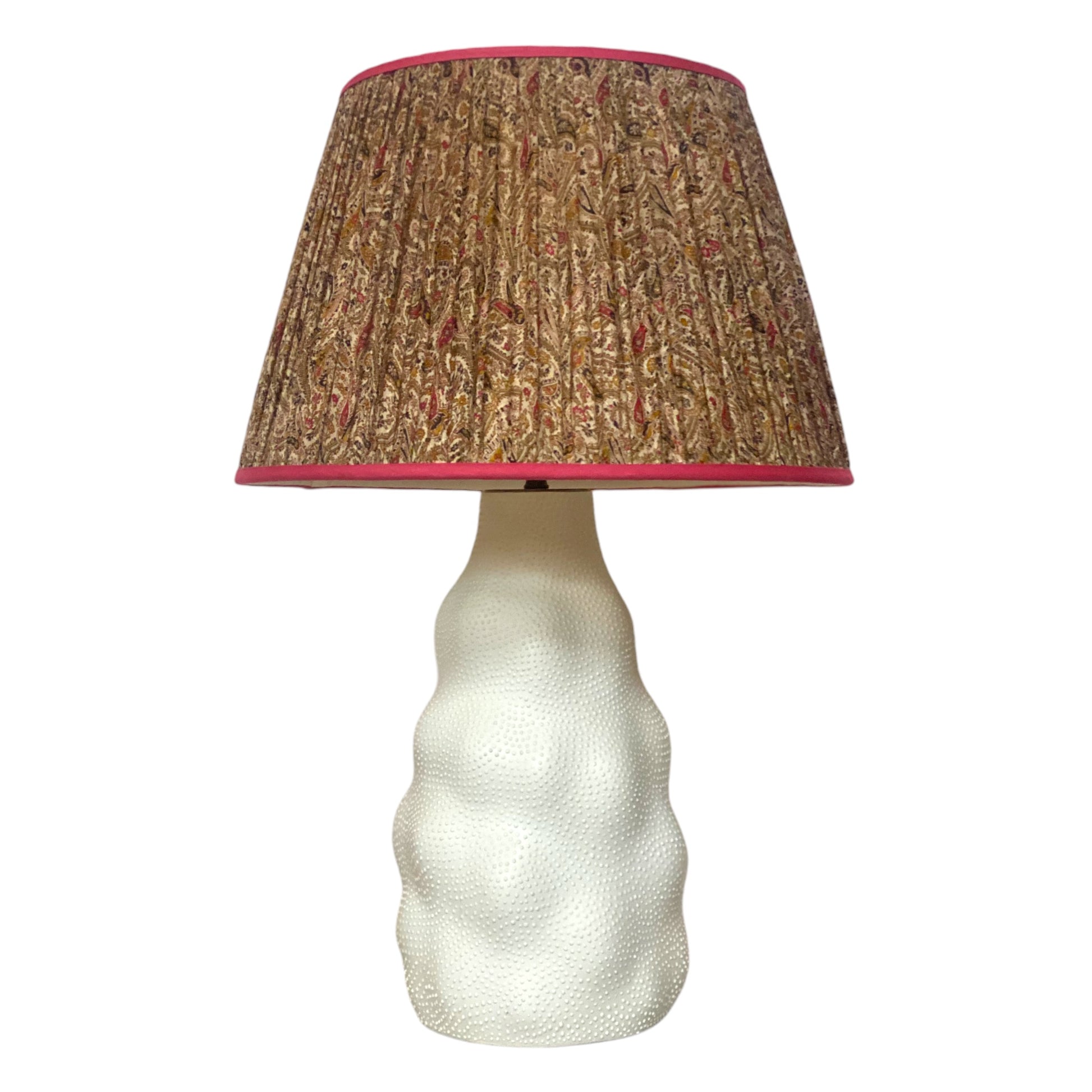 Oatmeal and pink lampshade on iki lamp