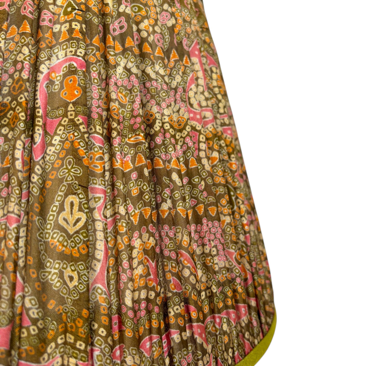 Close-up of the dotted pink, orange and cream paisley print on olive vintage silk sari