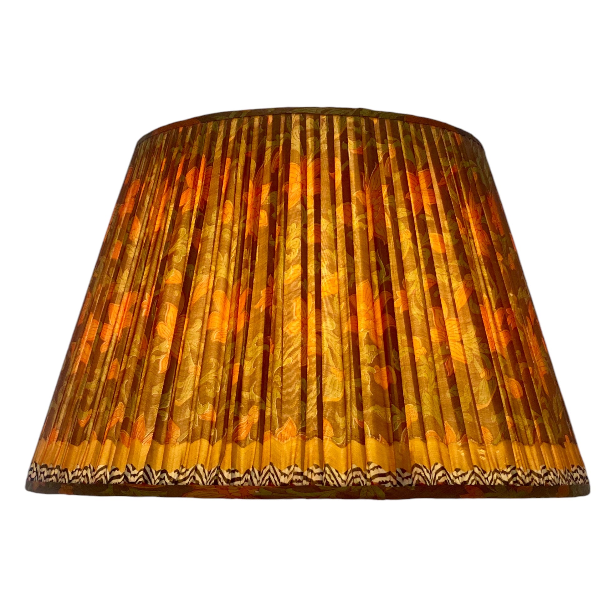 Orange and floral lampshade lit
