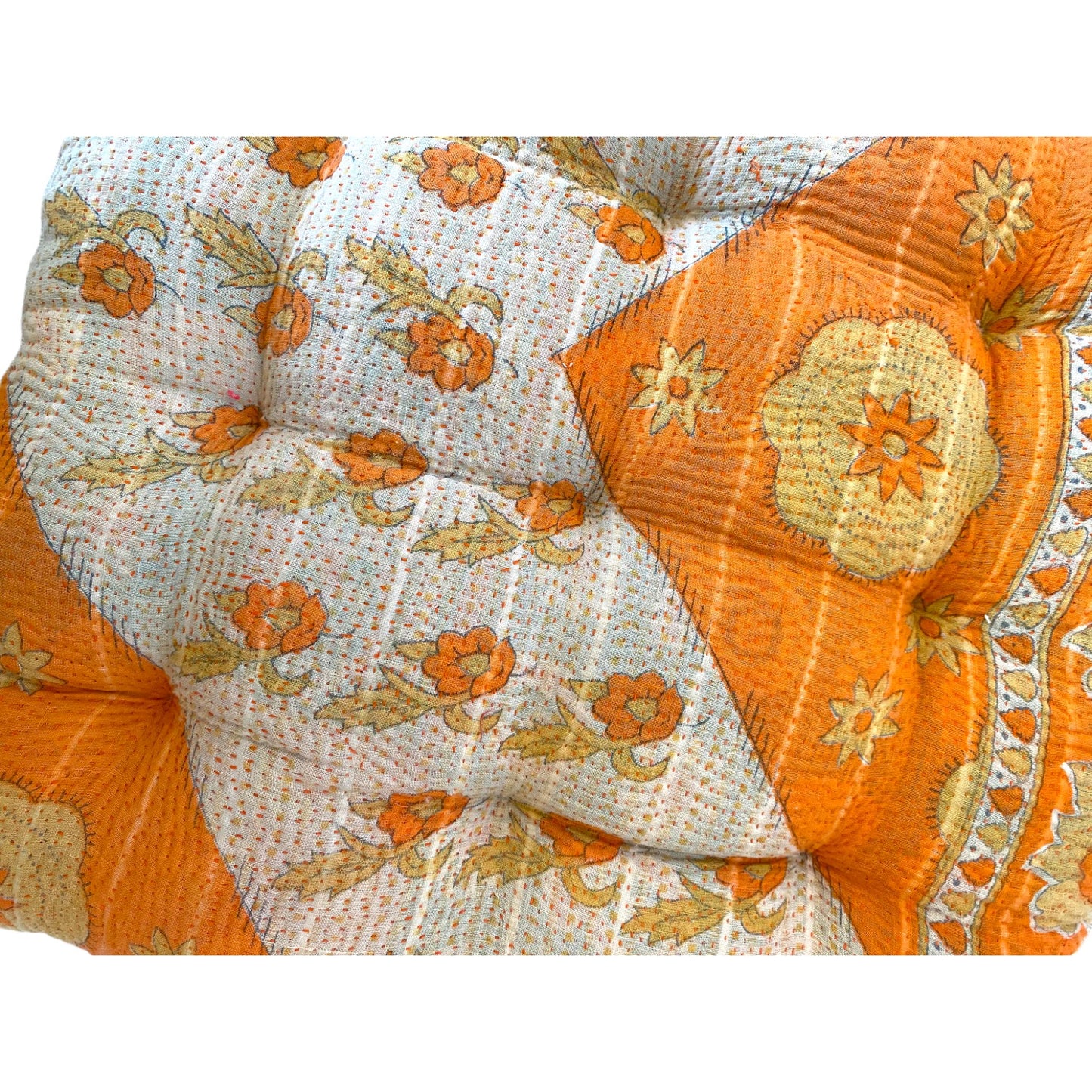 Close up of orange kantha seat pad