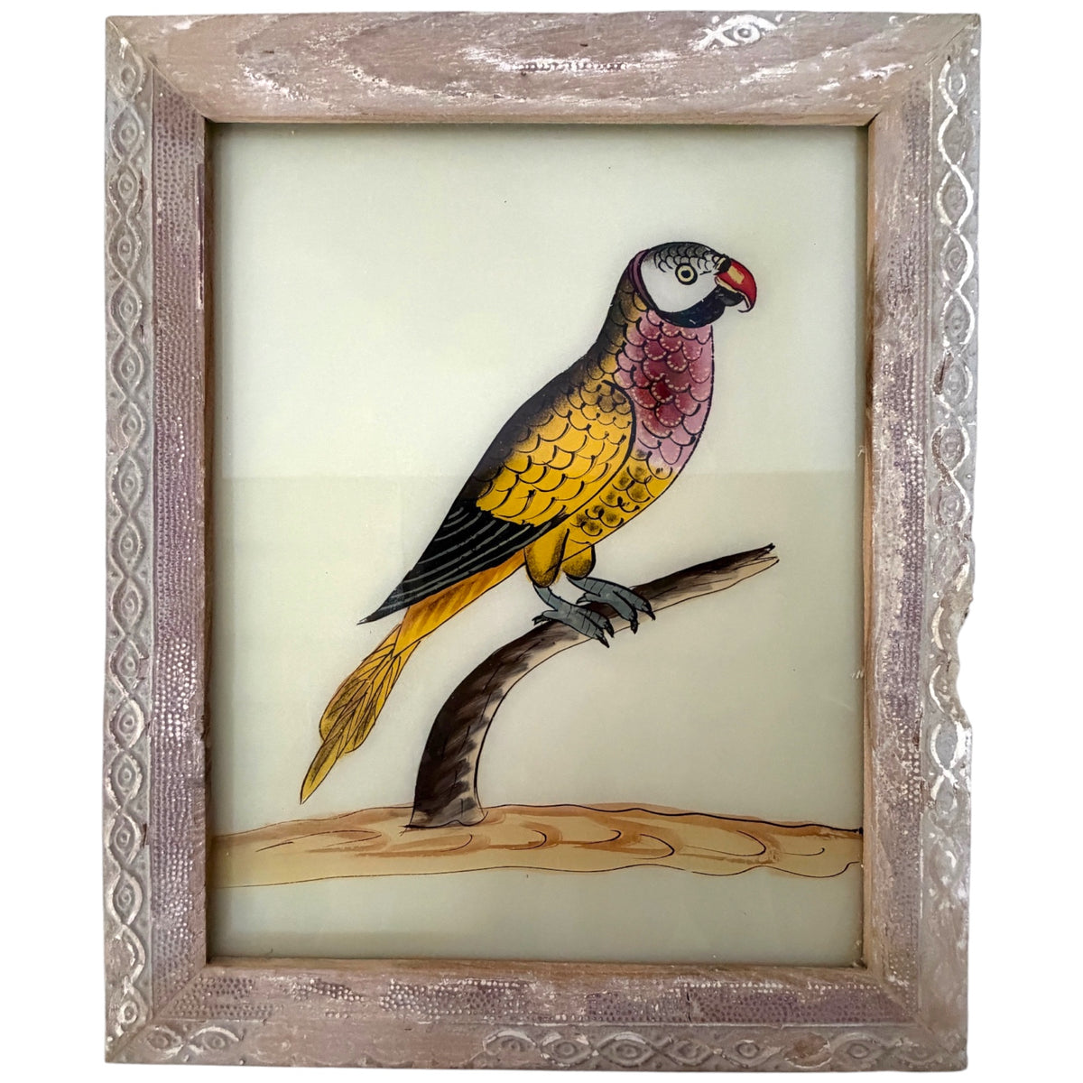 Hand-painted yellow and pink parakeet with red beak on a curved branch, reverse glass painting in a carved silver frame
