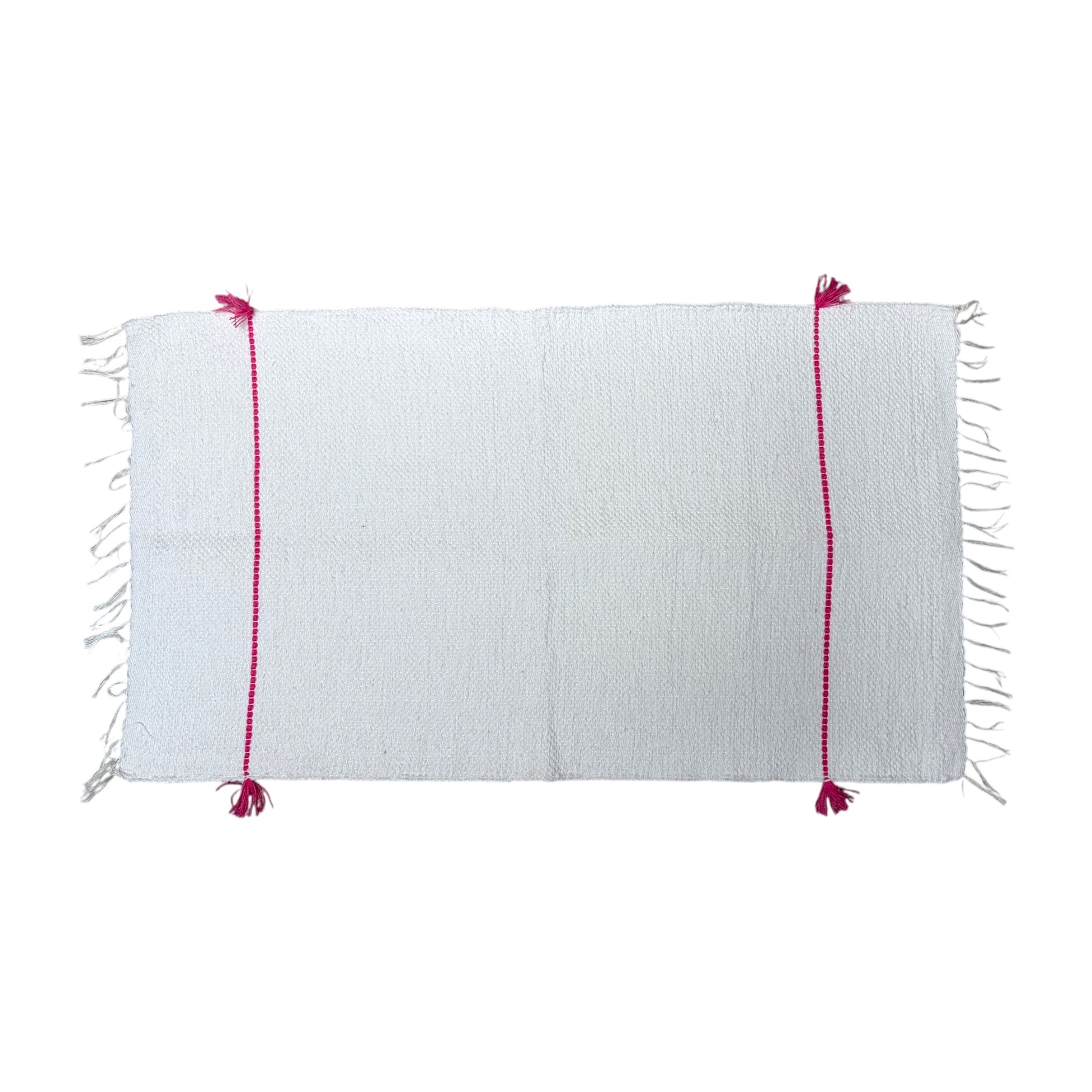 A white woven bath mat with fringe on the short ends and two vertical magenta-pink stitched stripes with tassels, shown flat against a white background.