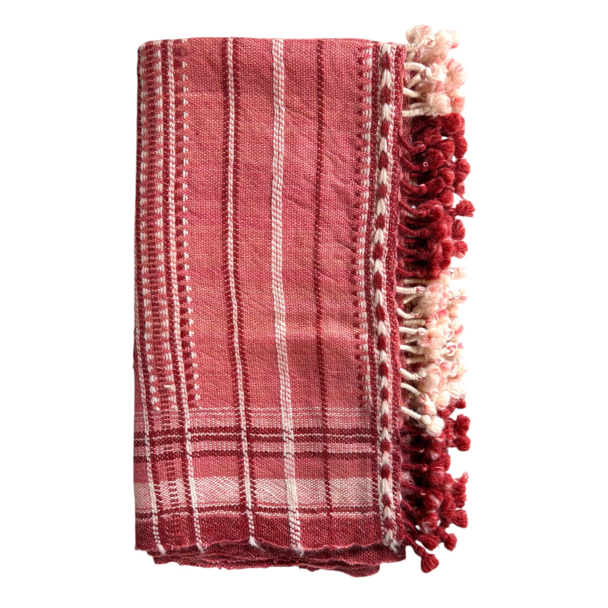 Pink and red woollen throw
