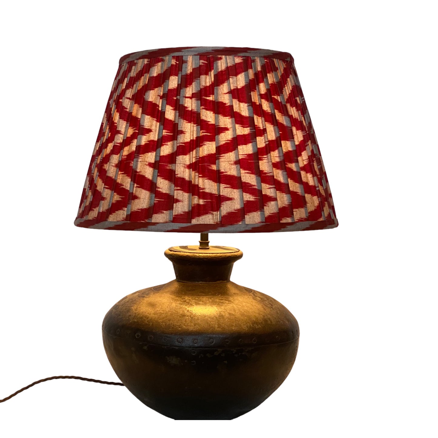 Red and grey ikat lampshade on Water carrier lamp base