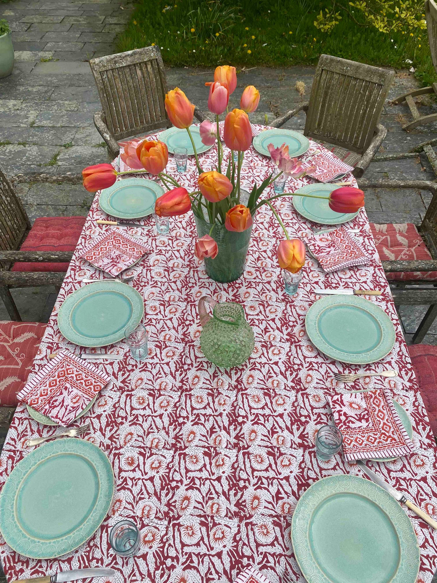 Tablescape with red and orange tablecloth