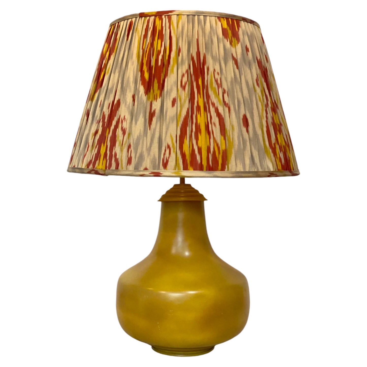 Red and yellow ikat lampshade on lamp